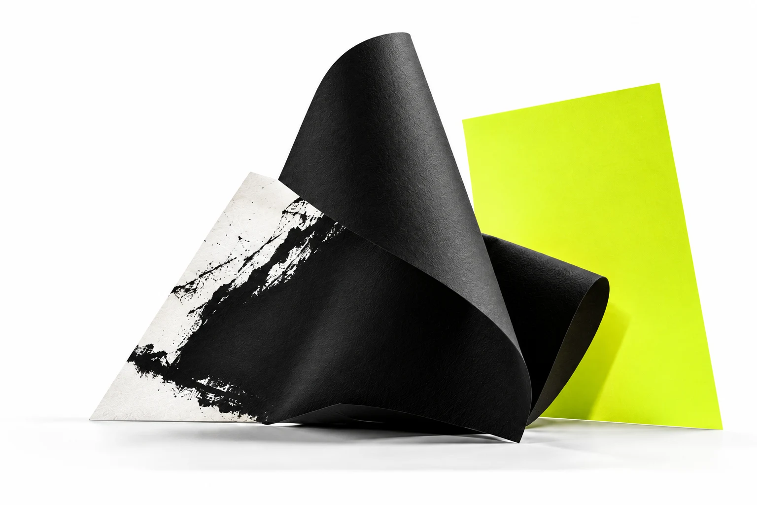 Sculptural black and white paper with a vivid chartreuse sheet